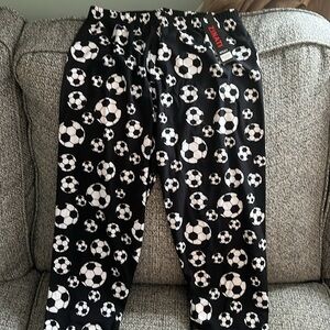 Buttery soft soccer ball leggings, never worn still has tags